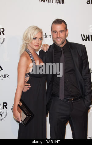 L'actrice Lindsay Lohan et designer allemand Philipp Plein de participer au Gala amfAR 2011 Milano, vente aux enchères et le dîner à la Permanente à Milan, Italie, le 23 septembre, 2011. Photo : Hubert Boesl Banque D'Images