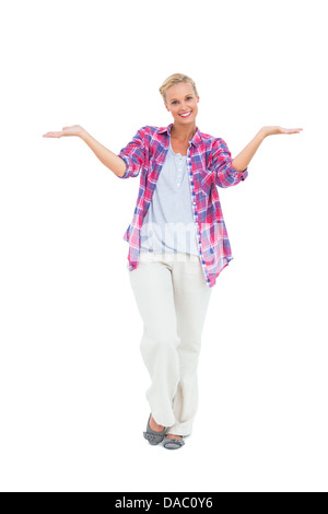 Blonde woman standing with arms open Banque D'Images