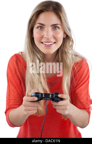 Blonde woman playing video games Banque D'Images