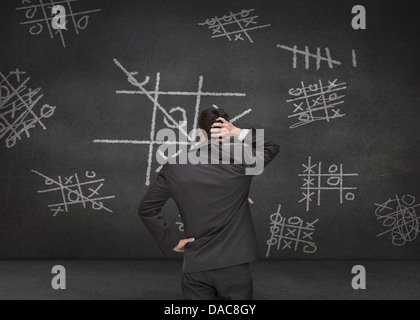 Thoughtful man Tic-tac-toe game Banque D'Images