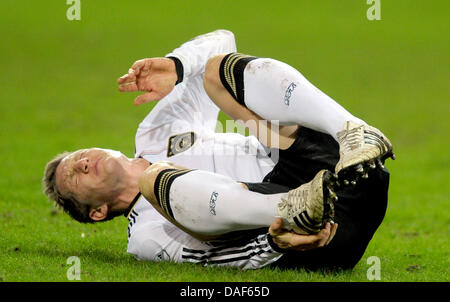 Bastian Schweinsteiger l'Allemagne réagit pendant le match de football amical entre l'Allemagne et l'Italie au stade Signal Iduna Park de Dortmund, Allemagne, 09 février 2011. Photo : Federico Gambarini Banque D'Images