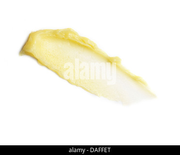 Gel Crème orange jaune coupé d'huile sur un fond blanc Banque D'Images