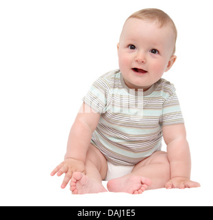 Beau rire happy baby boy sitting on bed blanc Banque D'Images