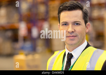 Businessman standing in warehouse Banque D'Images
