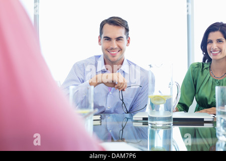 Businessman smiling in meeting Banque D'Images