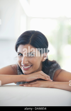 Businesswoman smiling on sofa Banque D'Images