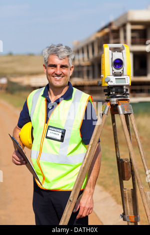 Happy land surveyor portrait outdoors Banque D'Images