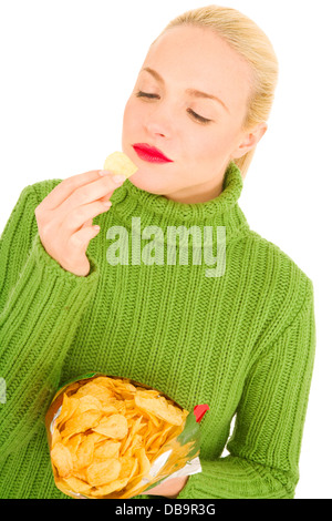 Woman eating crisps Banque D'Images