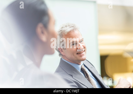 Smiling businessman in meeting Banque D'Images