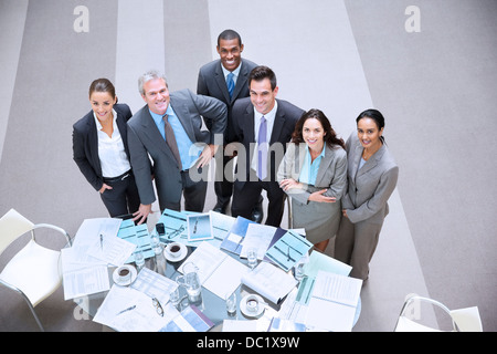 High angle portrait of smiling business people at table Banque D'Images