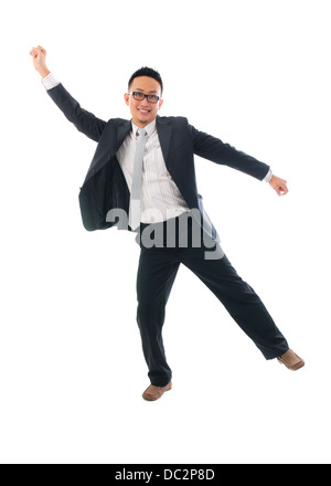 Cheerful businessman danse de succès sur un fond blanc Banque D'Images