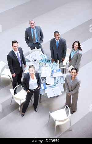 High angle portrait of smiling business people at table Banque D'Images