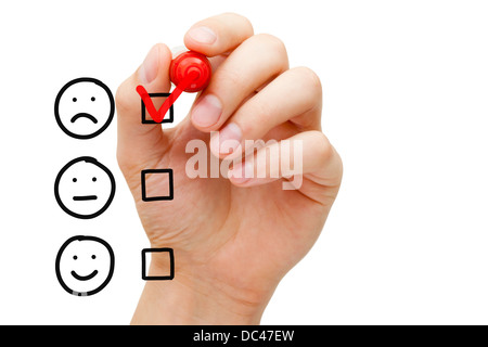 Mettre la main coche avec marqueur rouge sur le piètre service à la clientèle formulaire d'évaluation. Banque D'Images