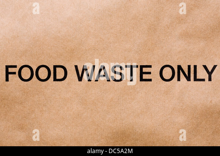 Les déchets alimentaires logo sur un sac en papier brun. Banque D'Images