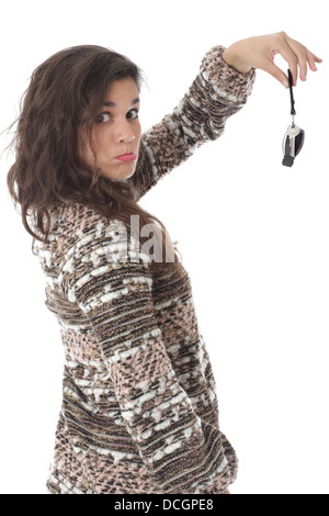 Parution du modèle. Triste Malheureux attractive young woman holding keys Banque D'Images