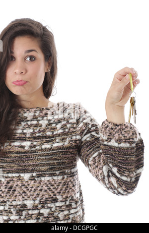 Parution du modèle. sad young woman holding house keys Banque D'Images