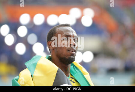 Usain Bolt de la Jamaïque réagit après les hommes Relais 4x100m à la 14e Finale es Championnats du monde d'athlétisme au stade Luzhniki de Moscou, Russie, 18 août 2013. Photo : Michael Kappeler/dpa  + + +(c) afp - Bildfunk + + + Banque D'Images