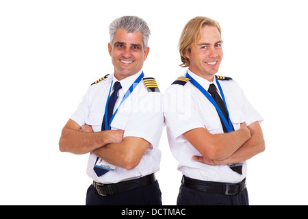 Deux pilotes de ligne aérienne en uniforme portrait sur fond blanc Banque D'Images