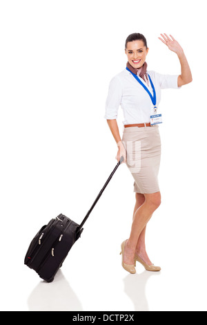 Cheerful young airhostess salué isolated on white Banque D'Images