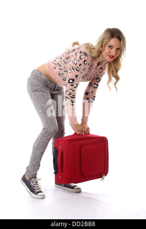 Parution du modèle. happy young woman with a red suitcase Banque D'Images