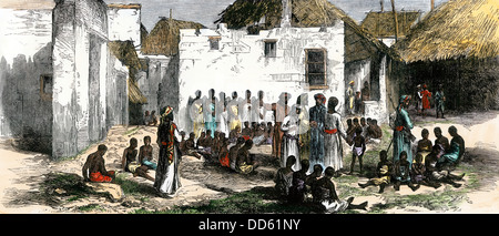 Le dernier marché aux esclaves, à Zanzibar en Afrique,1870. À la main, gravure sur bois Banque D'Images