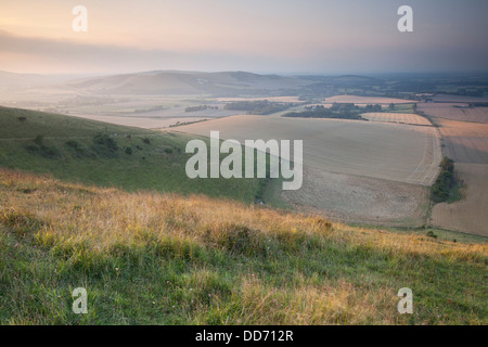 Coucher du soleil sur les South Downs de Beacon Firle, Sussex, Angleterre. Banque D'Images