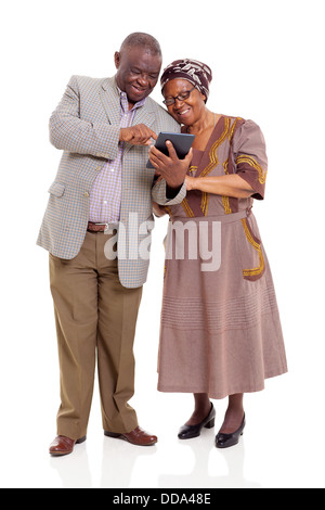 Old African couple using tablet computer isolated on white Banque D'Images