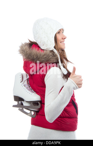 Jolie femme patin à glace l'hiver activités sportives en bouchon blanc du visage souriant et showing thumb up close-up isolé sur un bac blanc Banque D'Images