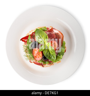 Bacon avec des légumes et des verts dans la plaque Banque D'Images