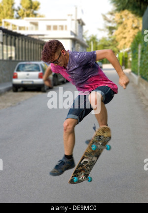 Street skateur professionnel faisant Ollie trick Banque D'Images