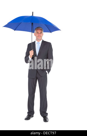 Businessman smiling at camera et tenue bleu Banque D'Images