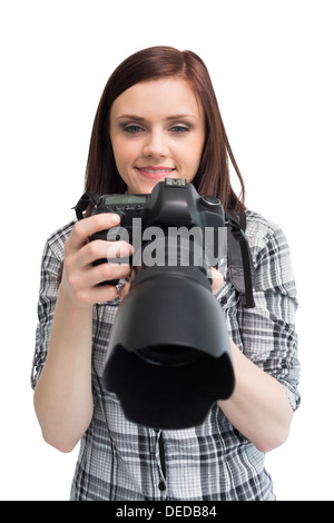 Smiling young casual photographer posing Banque D'Images