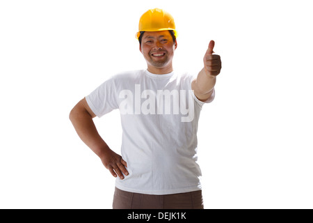 Building worker giving thumb up Banque D'Images