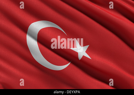 Brandissant le drapeau national de la Turquie dans le vent Banque D'Images