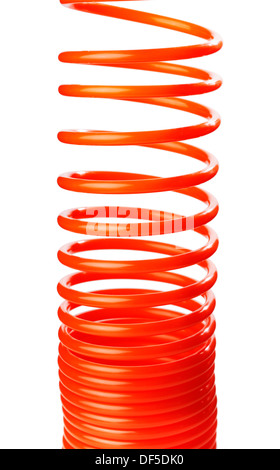 Spirale rouge fine orange flexible d'air utilisé pour outils pneumatiques. Banque D'Images