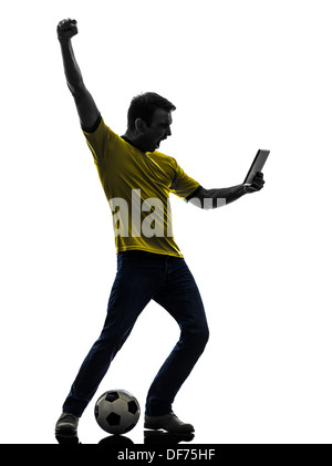 One man holding digital tablet en silhouette sur fond blanc Banque D'Images