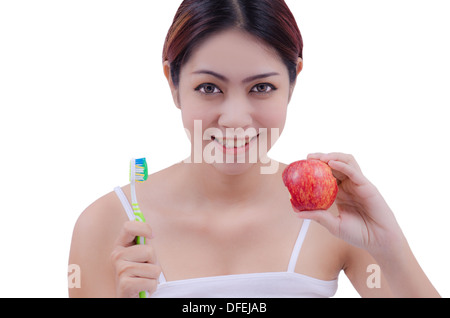 Femme avec beaucoup de dents holding toothbrush, isolé sur fond blanc Banque D'Images