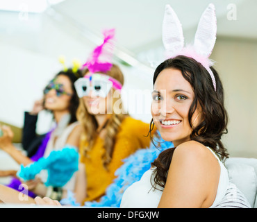 Woman wearing Bunny Ears at party Banque D'Images