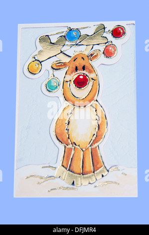 Fun Rudolph the Red Nosed Reindeer à Noël sur une carte de Noël Banque D'Images