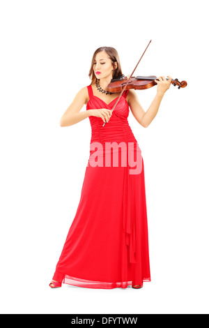 Portrait d'une jeune femme en robe rouge attrayant à jouer du violon Banque D'Images