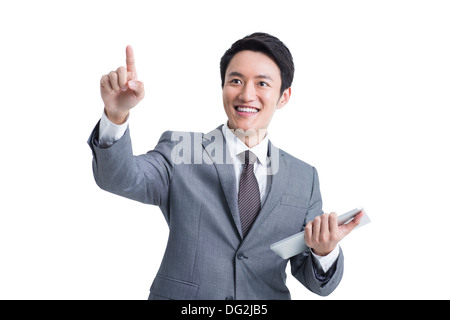 Young businessman with digital tablet pointing Banque D'Images