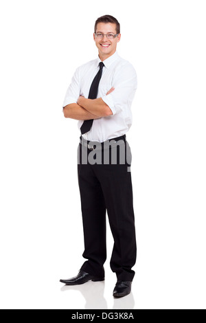 Young businessman standing with arms crossed sur fond blanc Banque D'Images