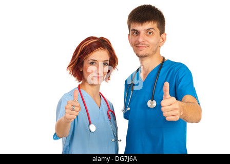 Deux jeunes médecins giving Thumbs up isolé sur fond blanc Banque D'Images