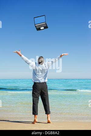 Rêves venir vrai. Premier jour de vacances.Businessman sur la plage Banque D'Images