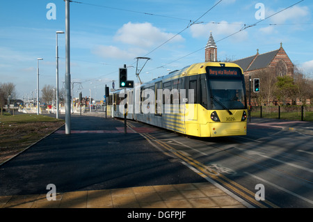 Tramway Metrolink sur la ligne East Manchester Ashton, nouveau Road, Clayton, Manchester, Angleterre, RU Banque D'Images