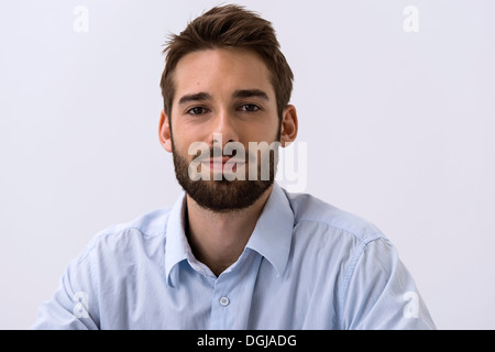 Close up portrait of young man in blue shirt Banque D'Images