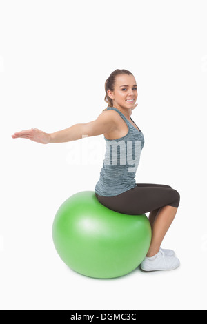 Belle fit woman stretching her arms Banque D'Images