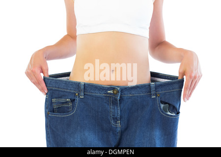 Close up of blonde wearing mince pantalon trop grand Banque D'Images