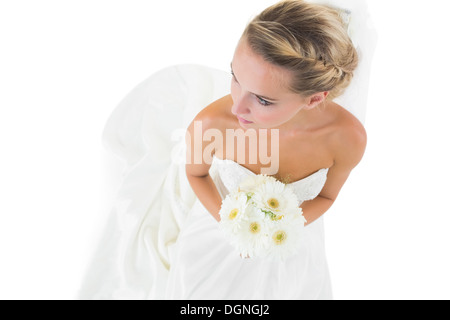 High angle view of blonde bride holding a bouquet Banque D'Images