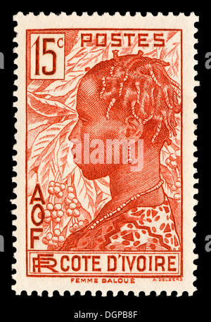 Timbre - Côte d'Ivoire femme Baloue et usine de café, 1936 Banque D'Images